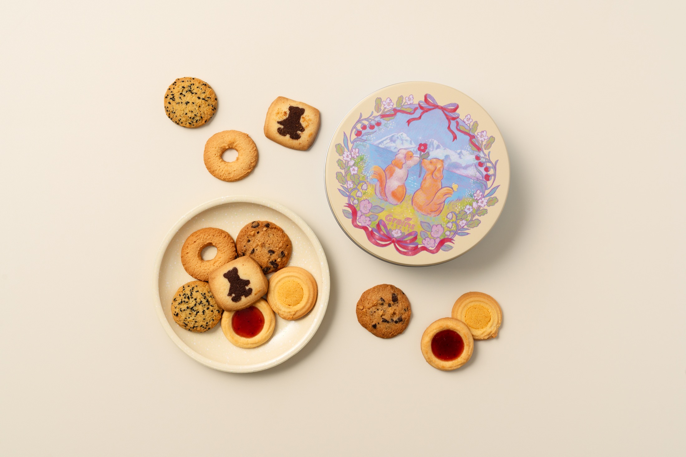 Detail of the illustrated dog-themed cookie tin.