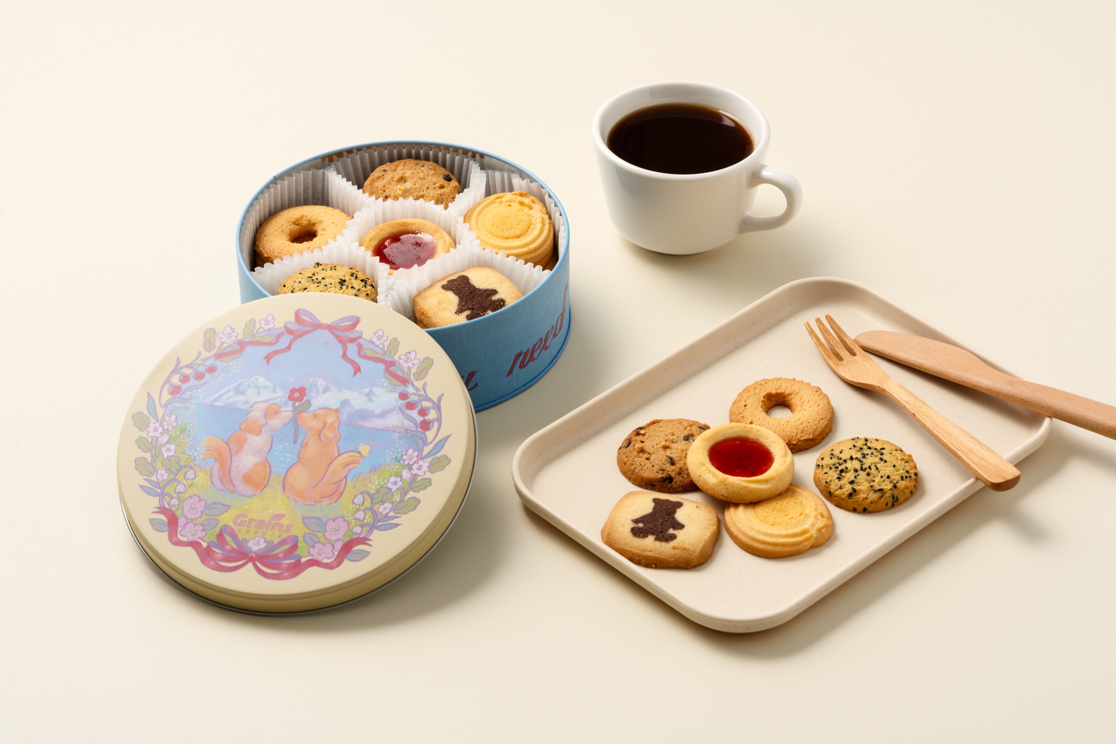 Dog-themed Grains Cookie gift tin and cookies.