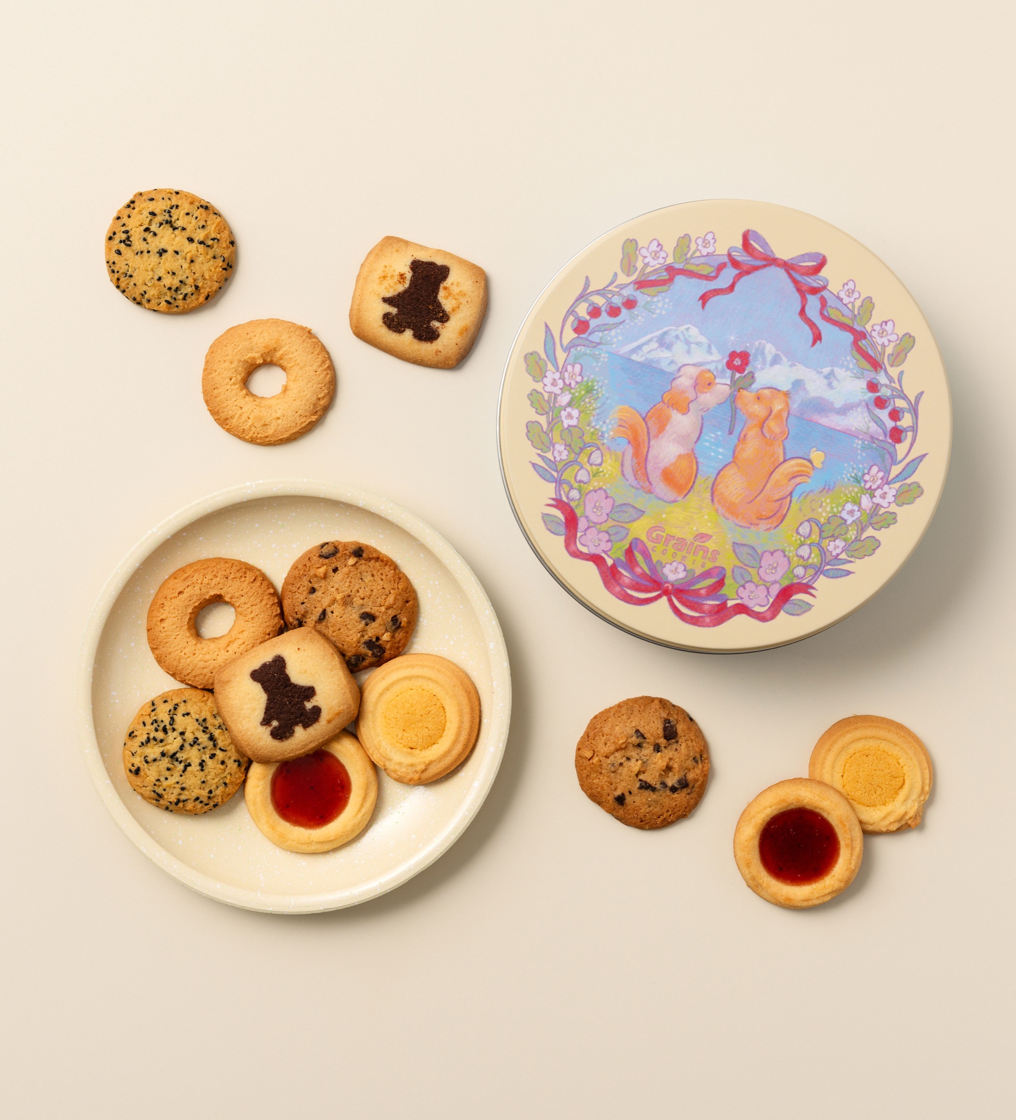 Dog-themed Grains Cookie gift tin with cookies.